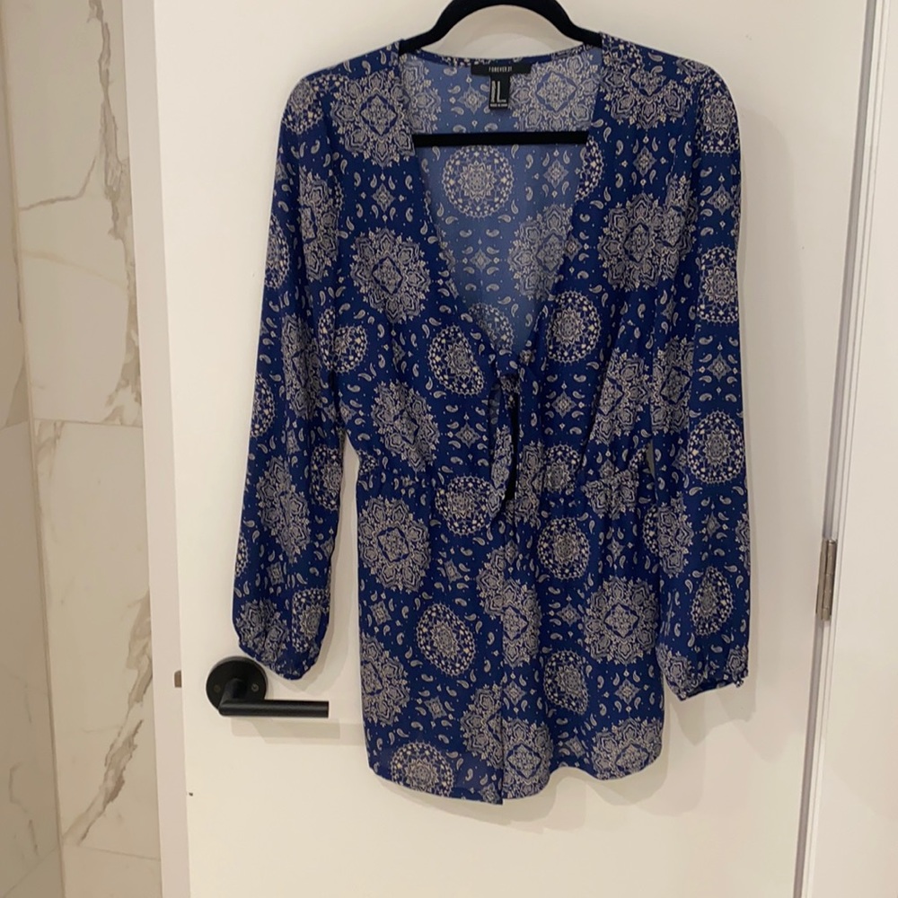 Blue with white pattern long sleeve romper. Size Medium. Worn once.